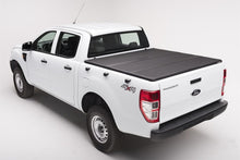 Load image into Gallery viewer, Extang 05-16 Nissan Frontier(5ft Bed) (w/ or w/o Track Sys) (5ft) Solid Fold 2.0